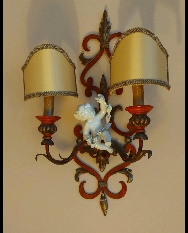 coppia applique ferro battuto con putto ceramica coppia applique ferro battuto con putto ceramica