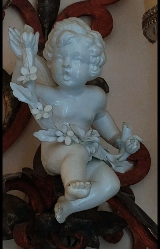 coppia applique ferro battuto con putto ceramica coppia applique ferro battuto con putto ceramica