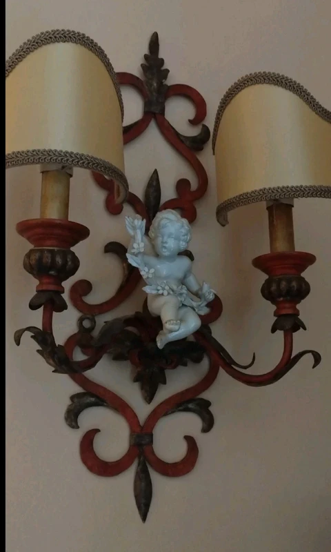 coppia applique ferro battuto con putto ceramica coppia applique ferro battuto con putto ceramica