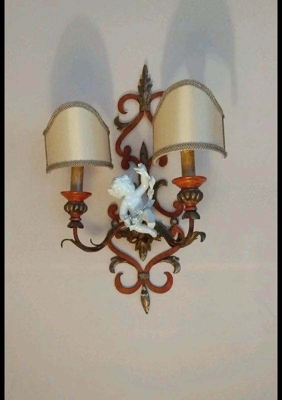 coppia applique ferro battuto con putto ceramica coppia applique ferro battuto con putto ceramica