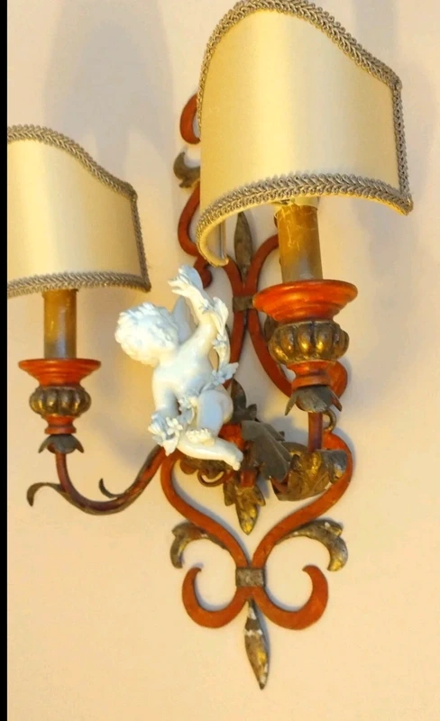 coppia applique ferro battuto con putto ceramica coppia applique ferro battuto con putto ceramica