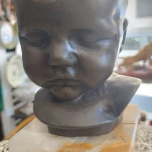 bronzo testa bambino neonato